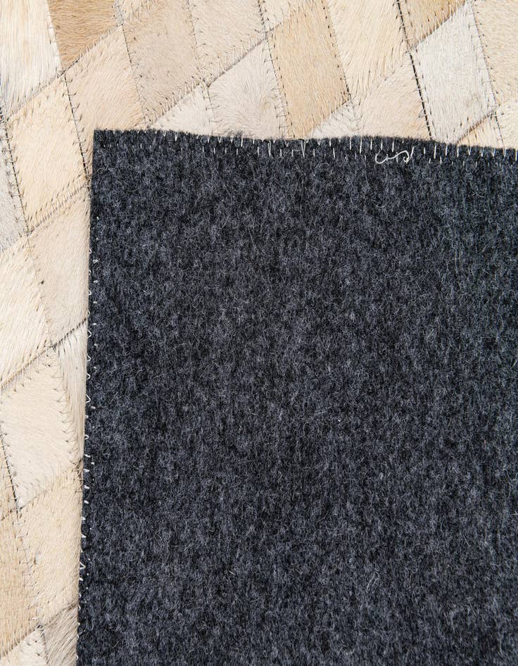 Detail image of 4' 1 x 5' 8 Cowhide Stocks Rug