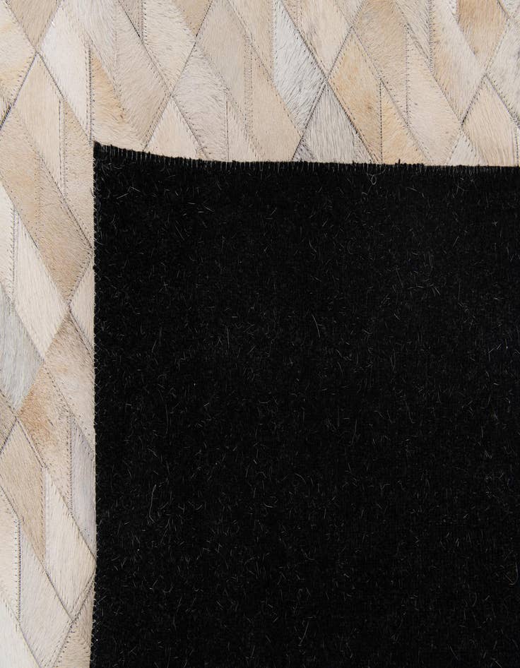 Detail image of 4' 5 x 5' 2 Cowhide Stocks Rug
