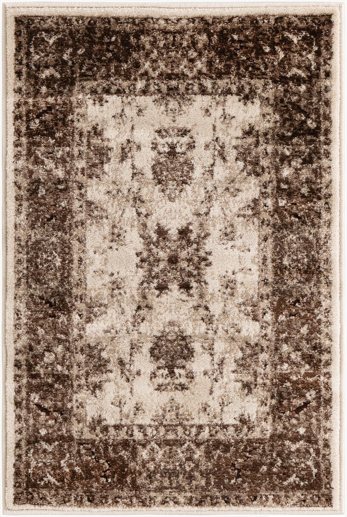 A 2x3 rectangular Nepal collection rug featuring a distressed traditional floral pattern in ivories and creams.