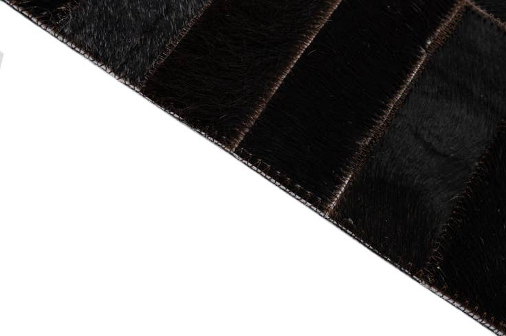 Detail image of 4' 11 x 8' 1 Cowhide - Patchwork Rug