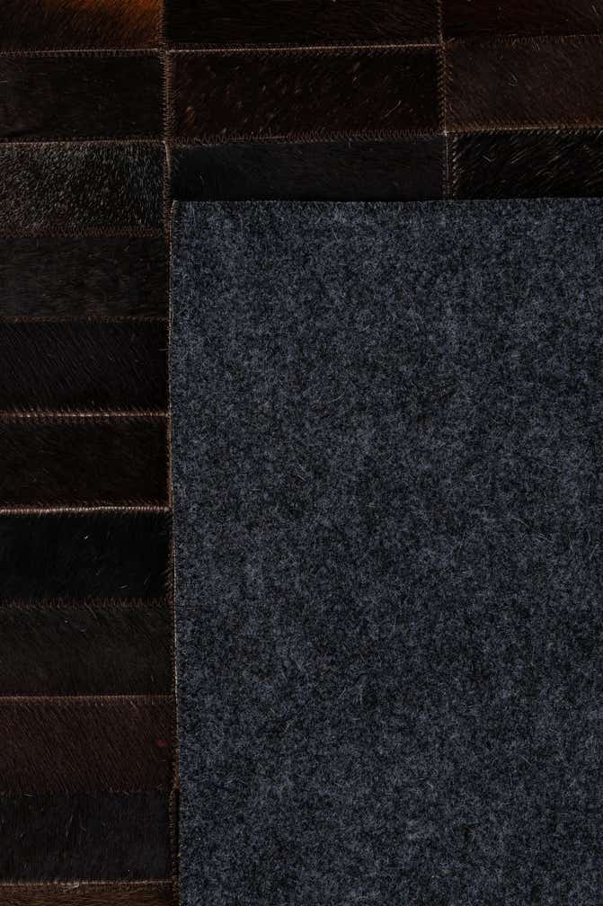 4' 11 x 8' 1 Cowhide - Patchwork Rug