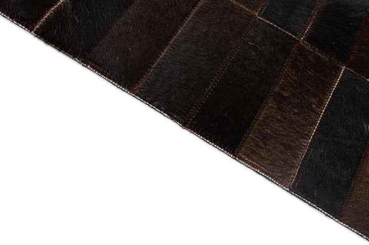 4' 11 x 8' 1 Cowhide - Patchwork Rug