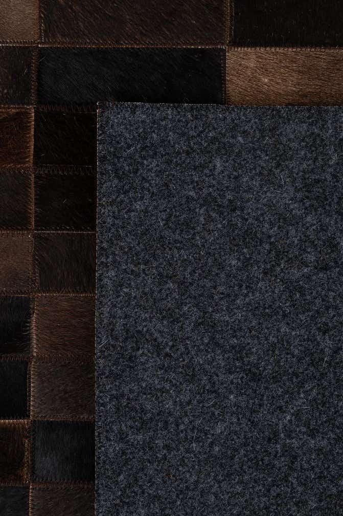4' 11 x 8' 1 Cowhide - Patchwork Rug
