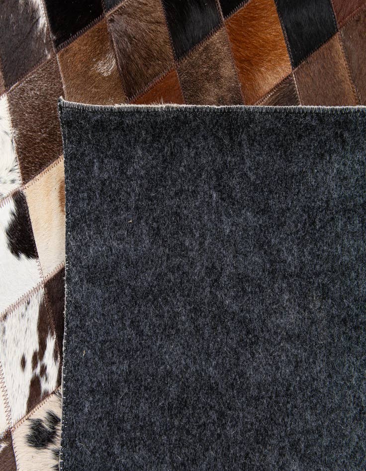 Detail image of 5' x 7' 11 Cowhide Stocks Rug