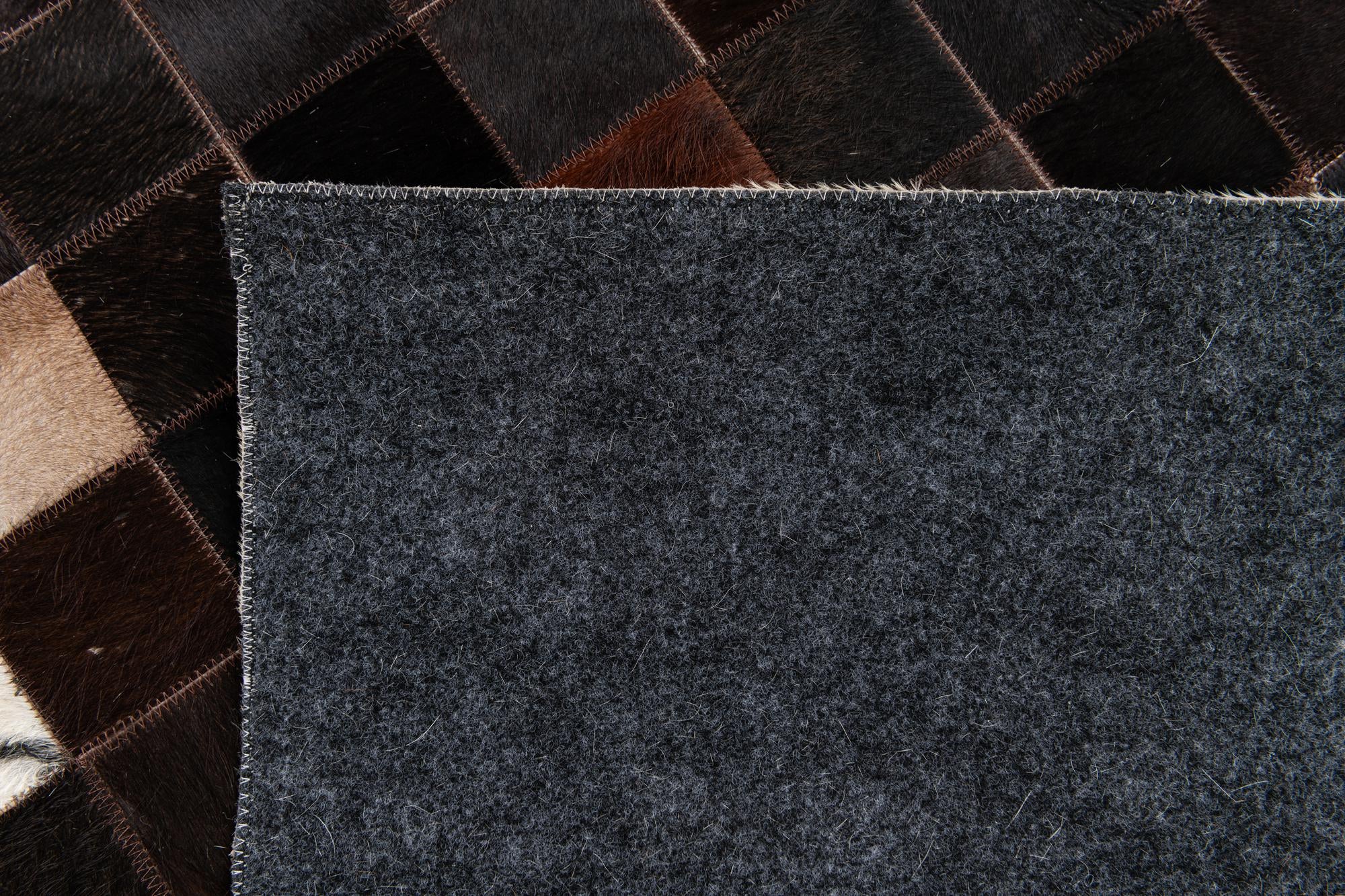 4' 11 x 7' 10 Cowhide Stocks Rug