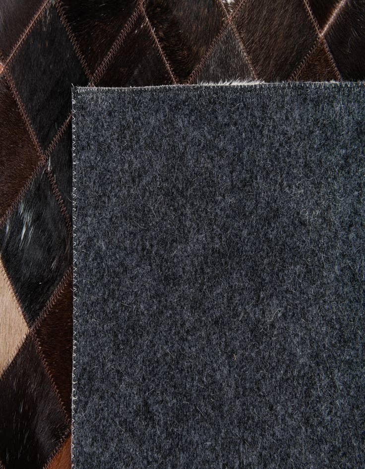 Detail image of 5' x 7' 11 Cowhide Stocks Rug