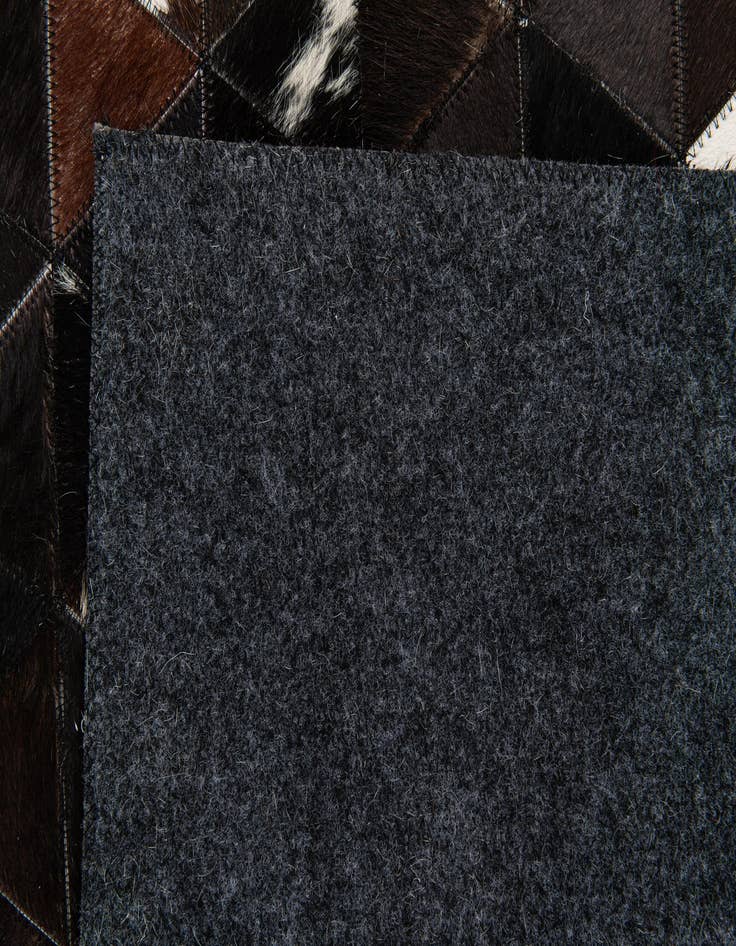 Detail image of 5' 1 x 8' Cowhide Stocks Rug