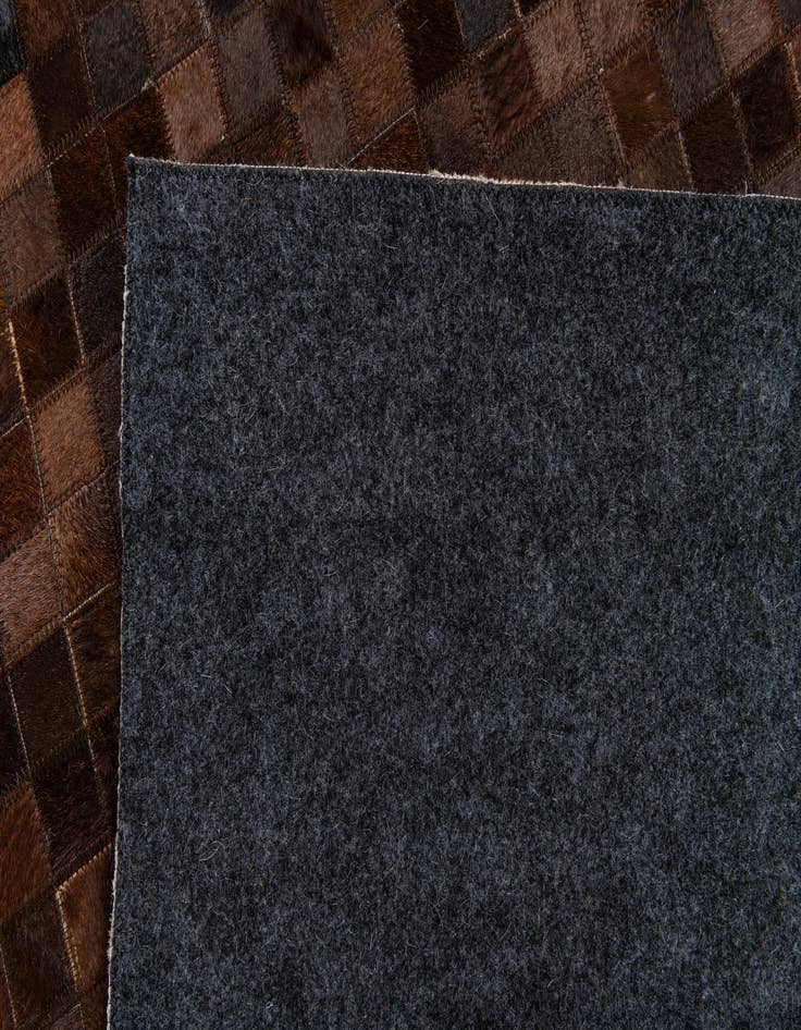 Detail image of 5' 2 x 8' Cowhide Stocks Rug
