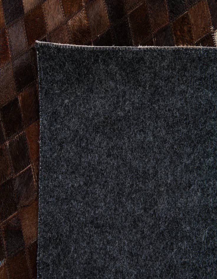 Detail image of 5' 1 x 8' 2 Cowhide Stocks Rug