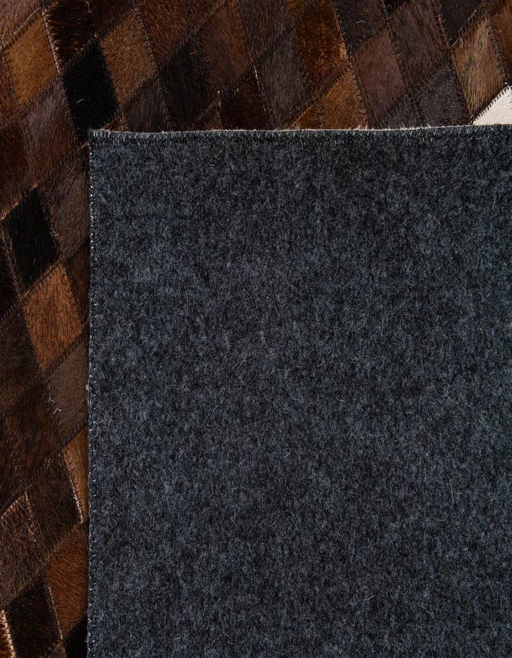 Detail image of 5' 2 x 8' 1 Cowhide Stocks Rug