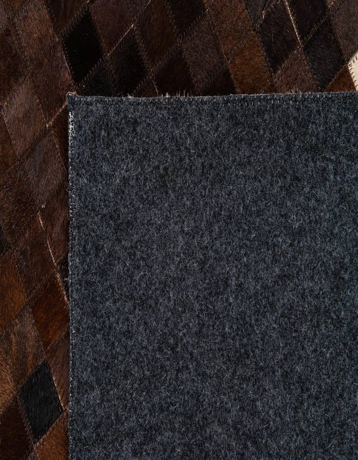 Detail image of 5' 2 x 8' 1 Cowhide Stocks Rug