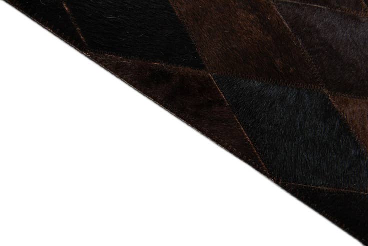 Detail image of 5' 2 x 8' Cowhide Stocks Rug