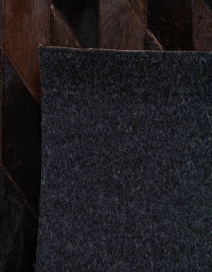 Detail image of 5' 2 x 8' Cowhide Stocks Rug