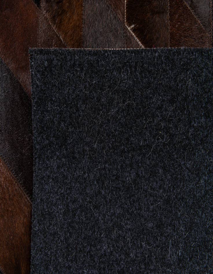 Detail image of 5' 2 x 8' Cowhide Stocks Rug
