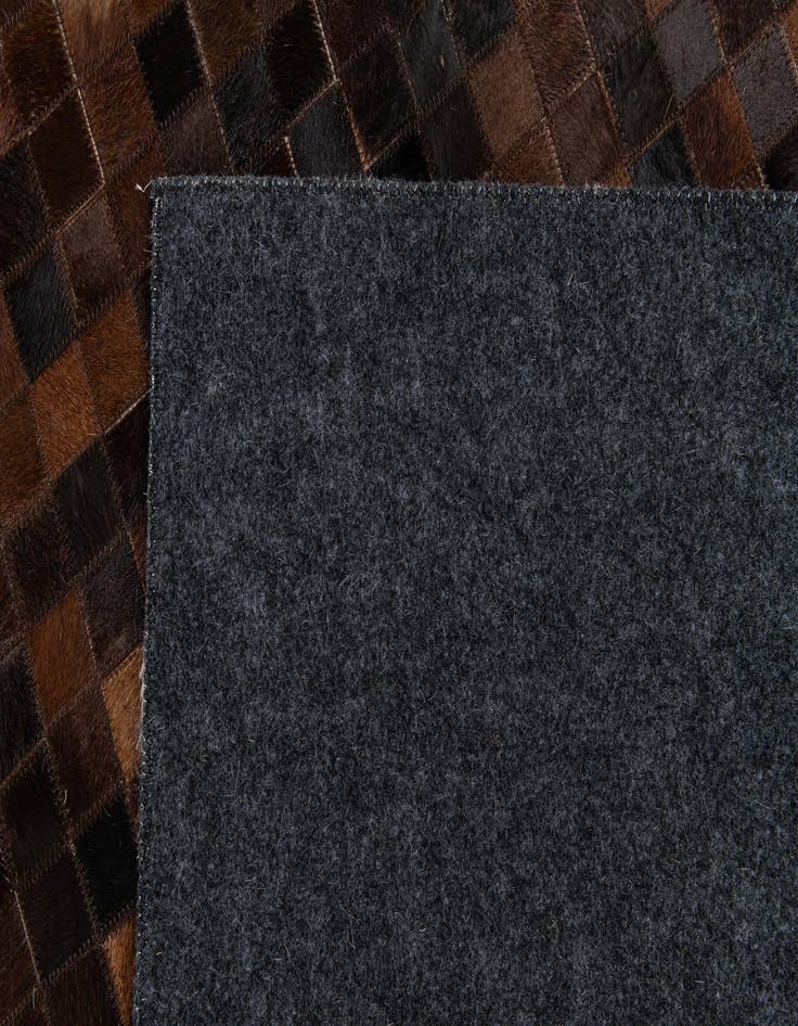 Detail image of 5' 2 x 8' Cowhide Stocks Rug