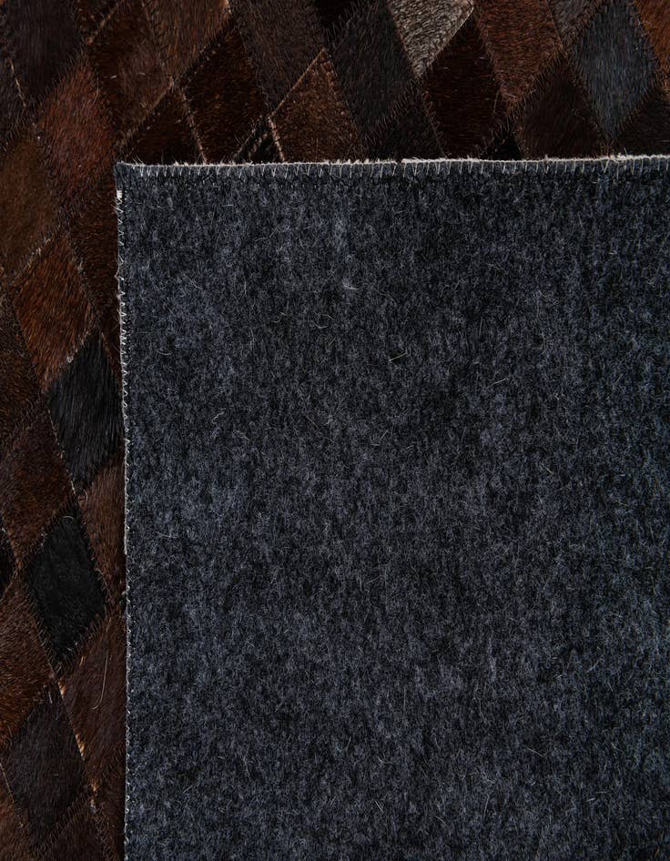 Detail image of 5' 1 x 8' 1 Cowhide Stocks Rug