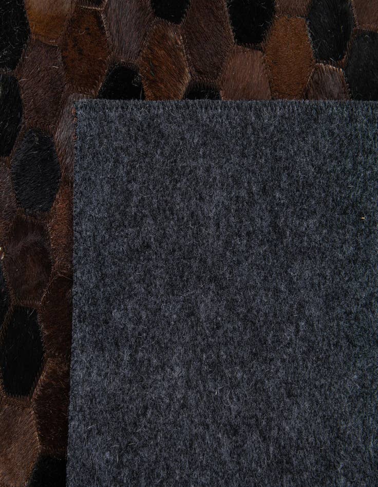 Detail image of 5' x 7' 11 Cowhide Stocks Rug