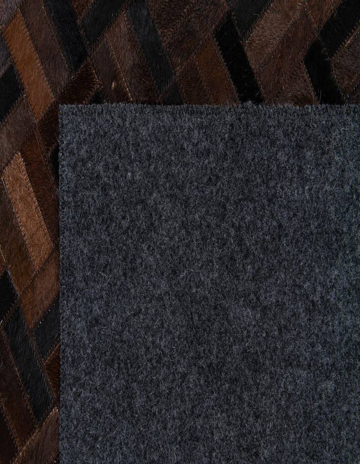 Detail image of 5' x 7' 11 Cowhide Stocks Rug