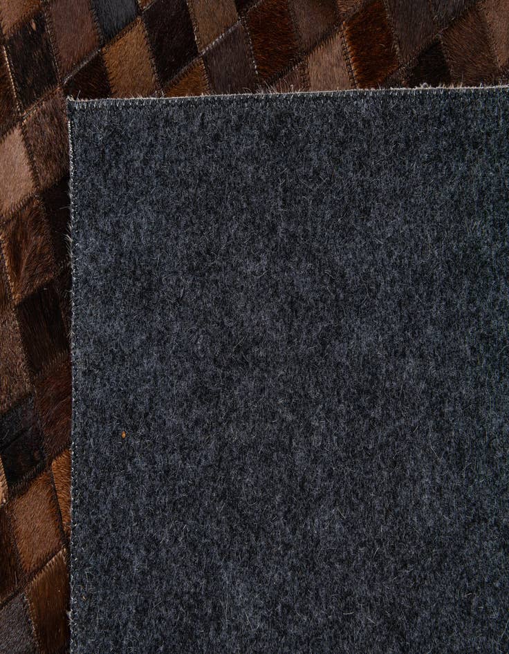 Detail image of 5' x 7' 11 Cowhide Stocks Rug