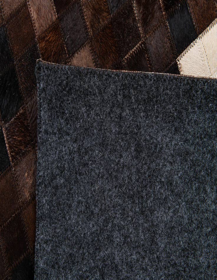 Detail image of 5' 1 x 8' Cowhide Stocks Rug