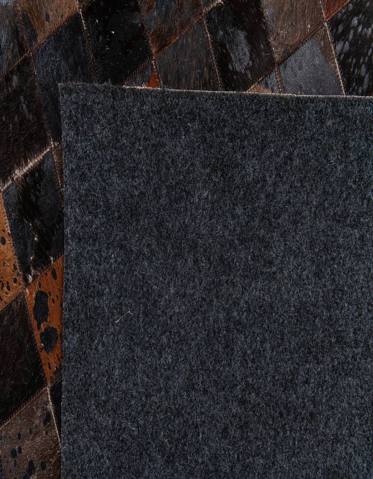 Detail image of 5' 1 x 8' 1 Cowhide Stocks Rug