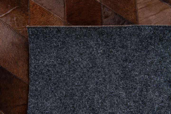 4' 8 x 6' 6 Cowhide Stocks Rug