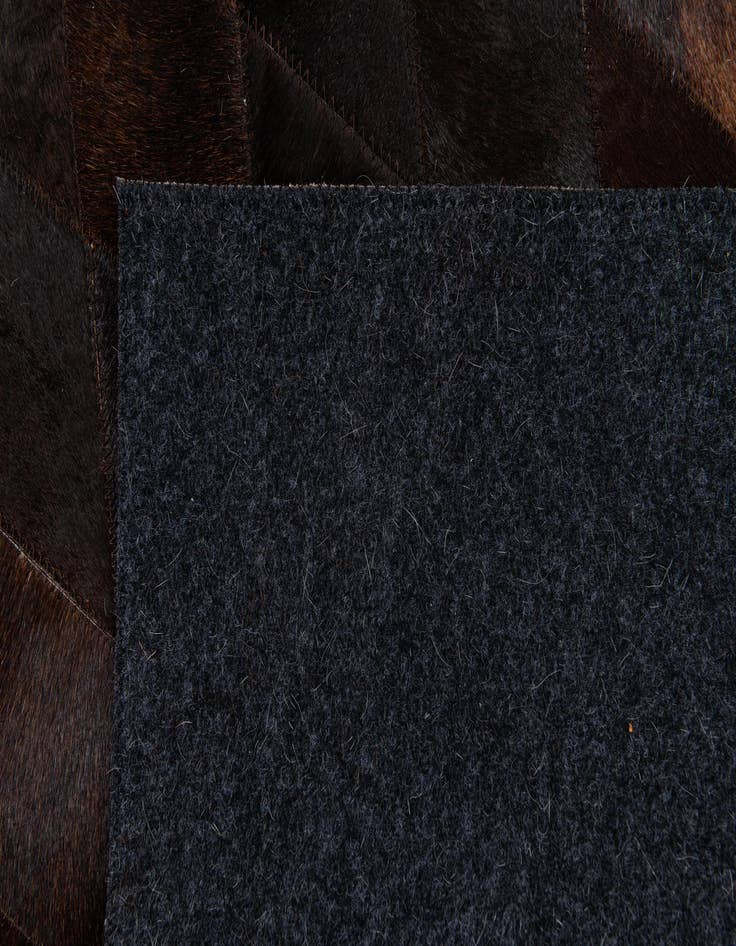 Detail image of 4' 8 x 6' 9 Cowhide Stocks Rug