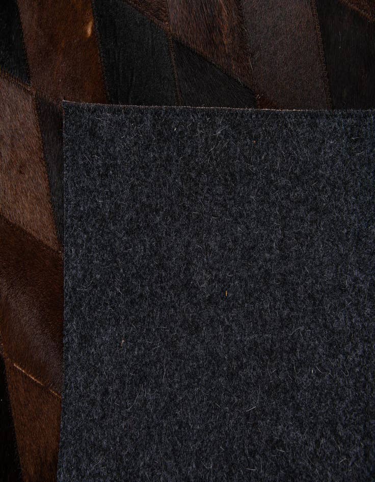 Detail image of 4' 1 x 5' 9 Cowhide Stocks Rug