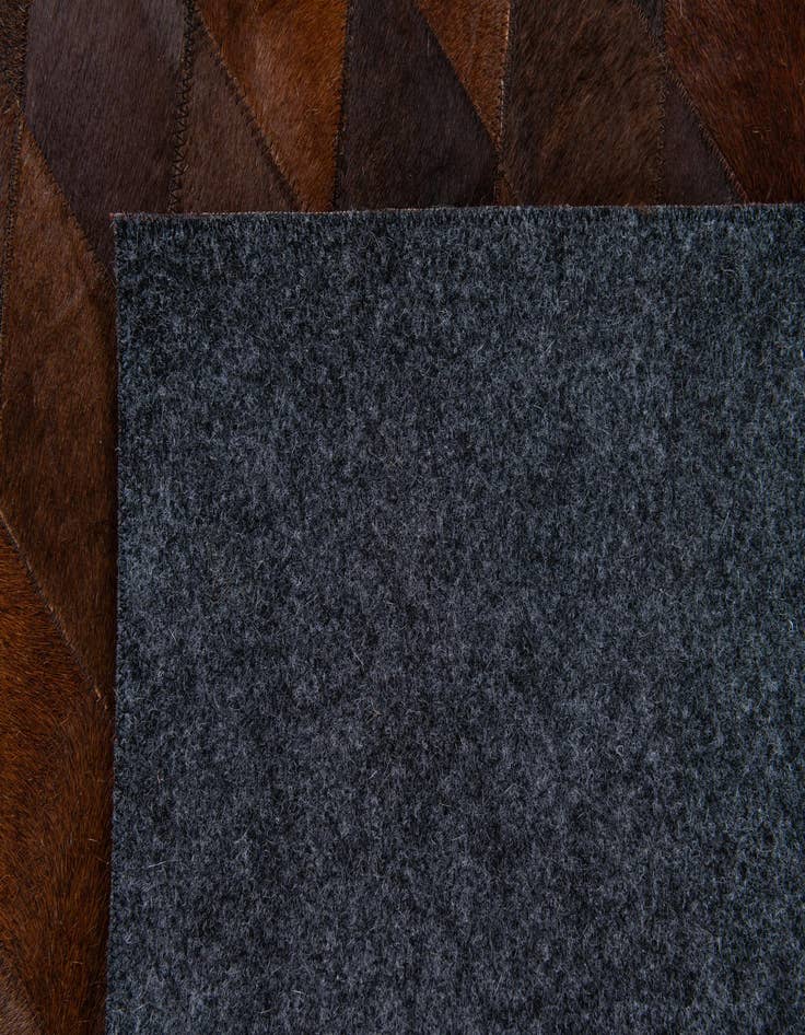 Detail image of 4' 1 x 5' 11 Cowhide Stocks Rug