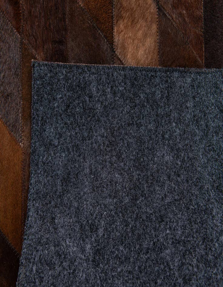 Detail image of 4' 1 x 5' 10 Cowhide Stocks Rug