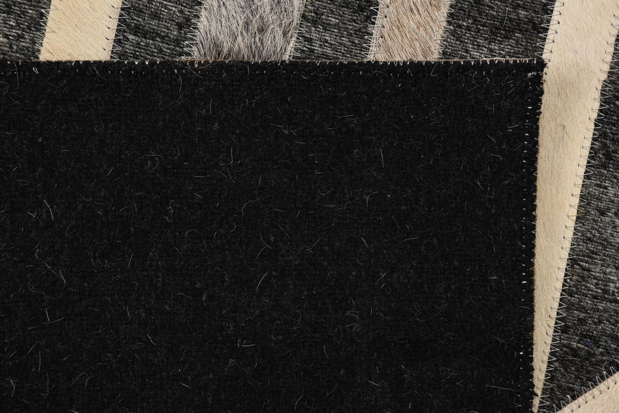 2' 2 x 3' 1 Cowhide Rug