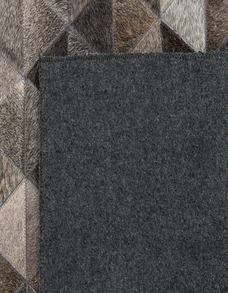 Detail image of 5' 1 x 8' 1 Cowhide Stocks Rug