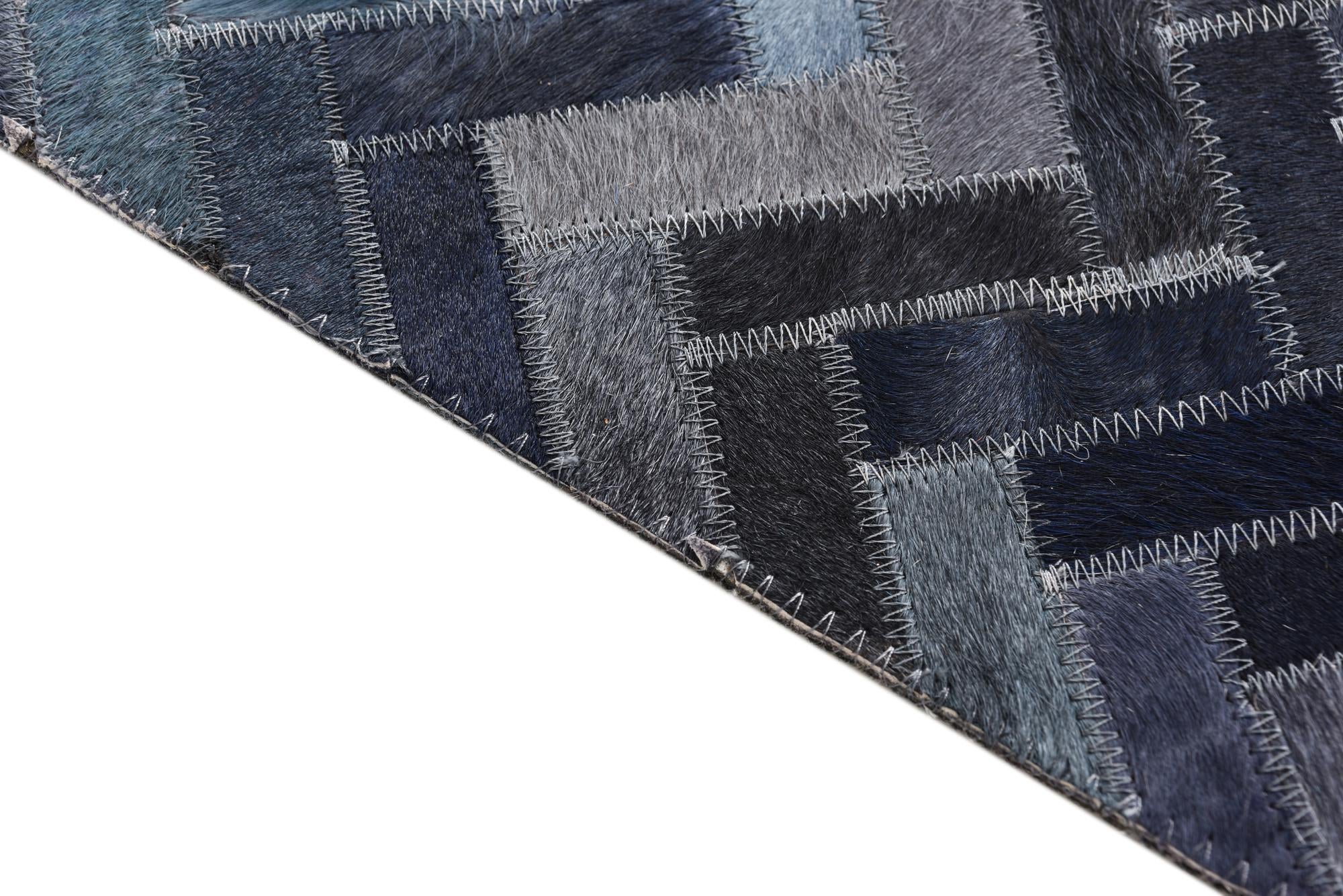 5' 2 x 8' 1 Cowhide Rug