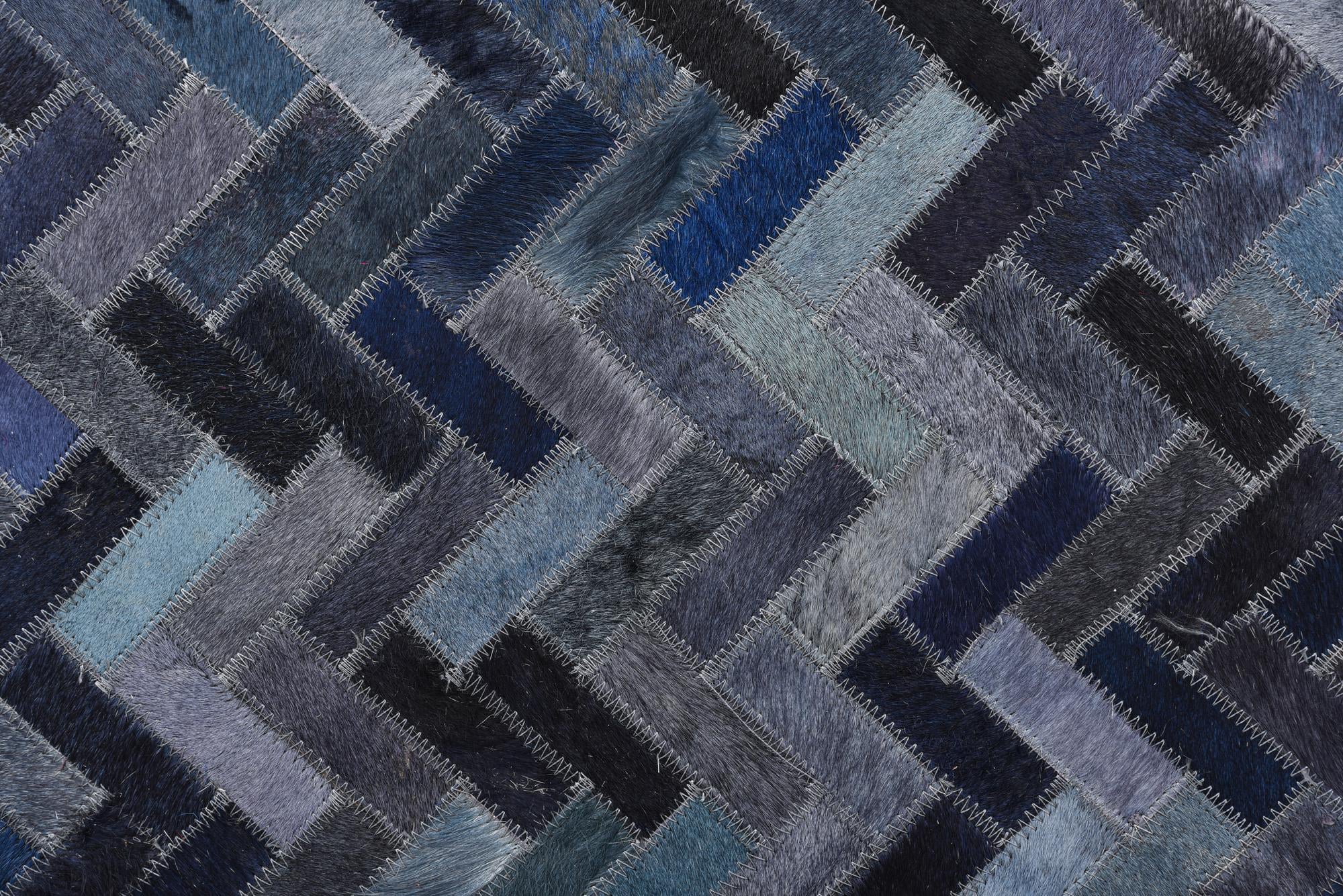 5' 2 x 8' 1 Cowhide Rug