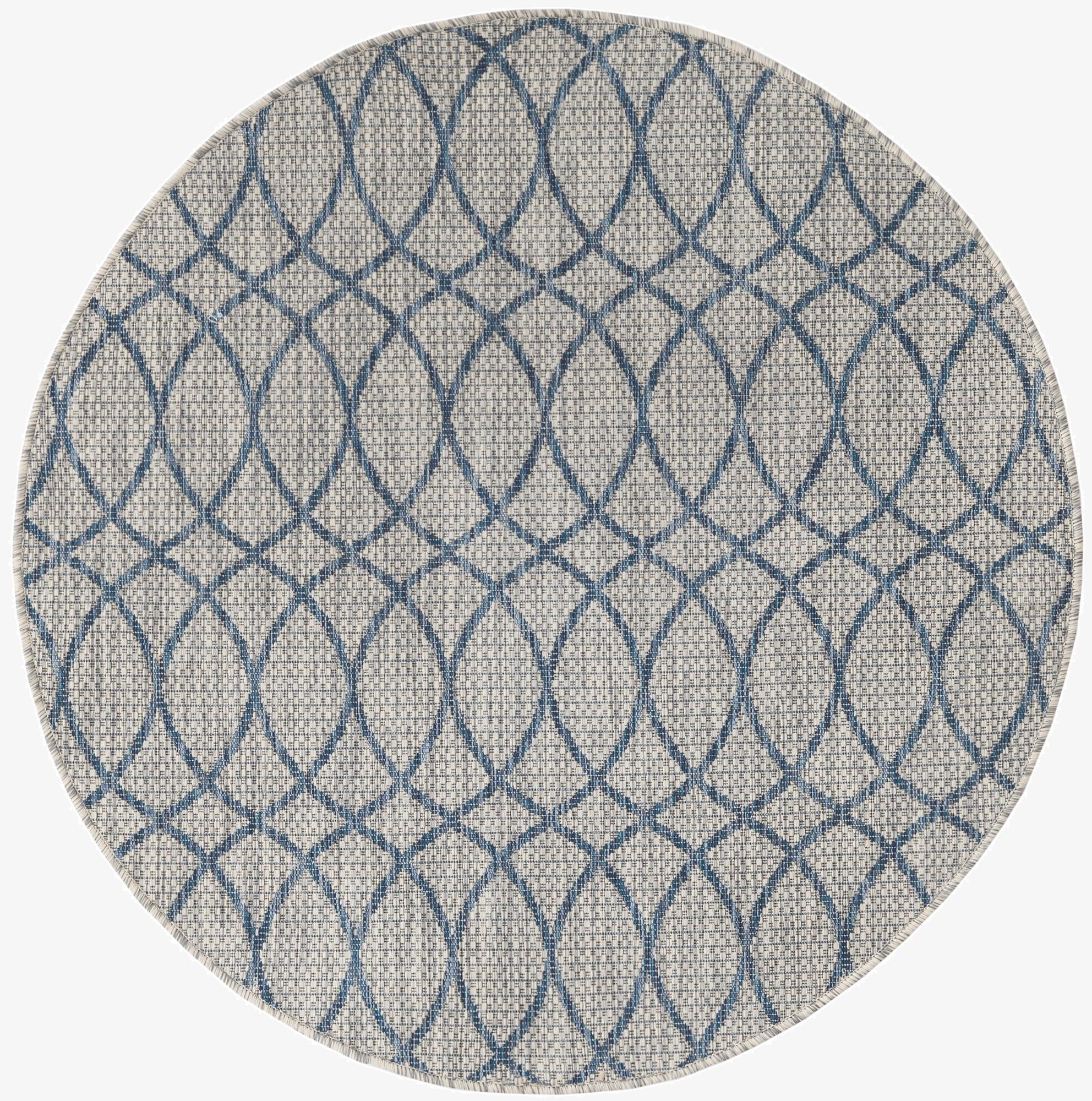 A 4' round blue and gray modern trellis indoor/outdoor rug with a flatweave texture, suitable for a patio.