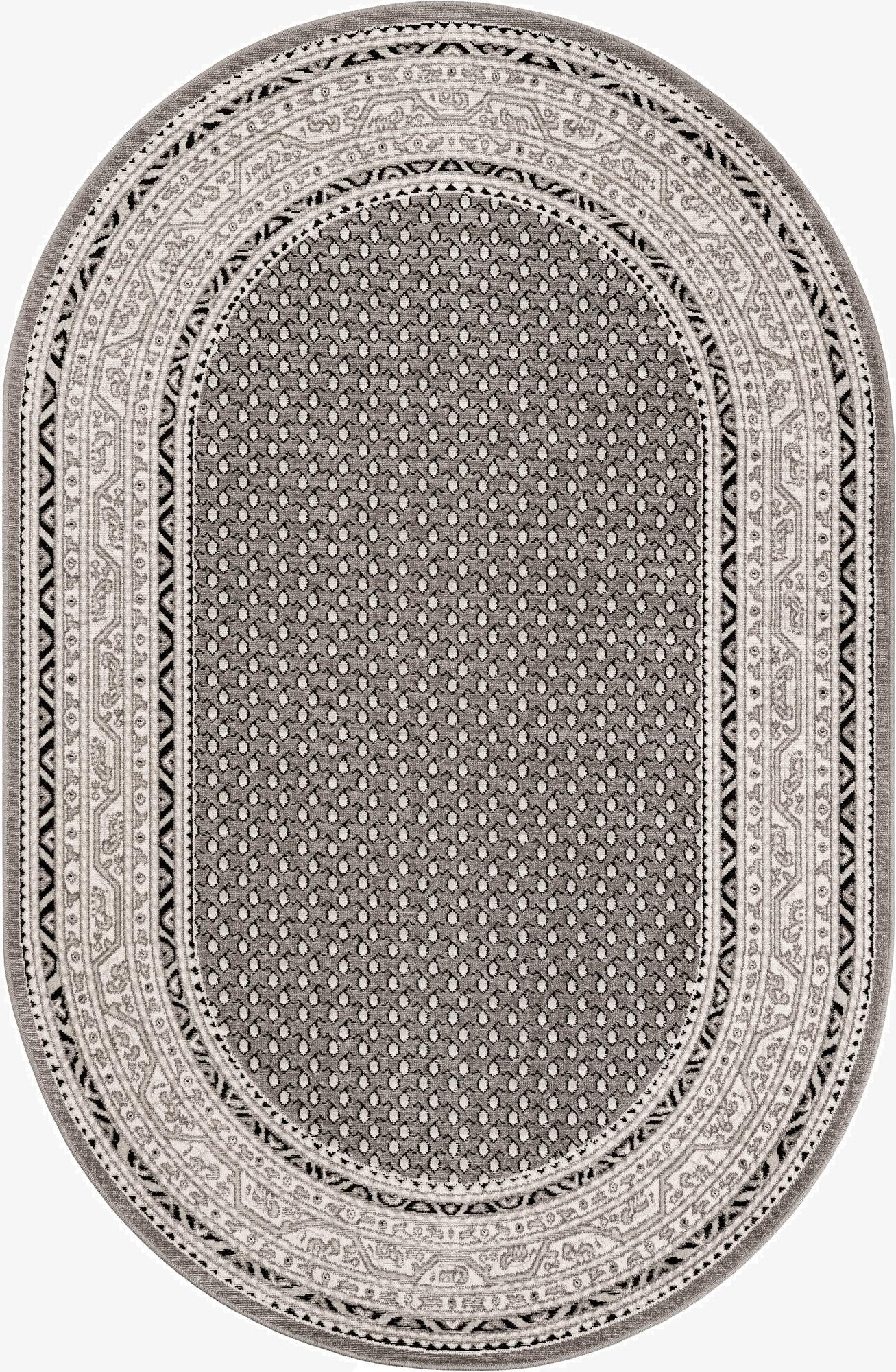 An oval gray SoHo rug with a central dotted pattern and an intricate border featuring tribal and Southwestern motifs in lighter gray and black.