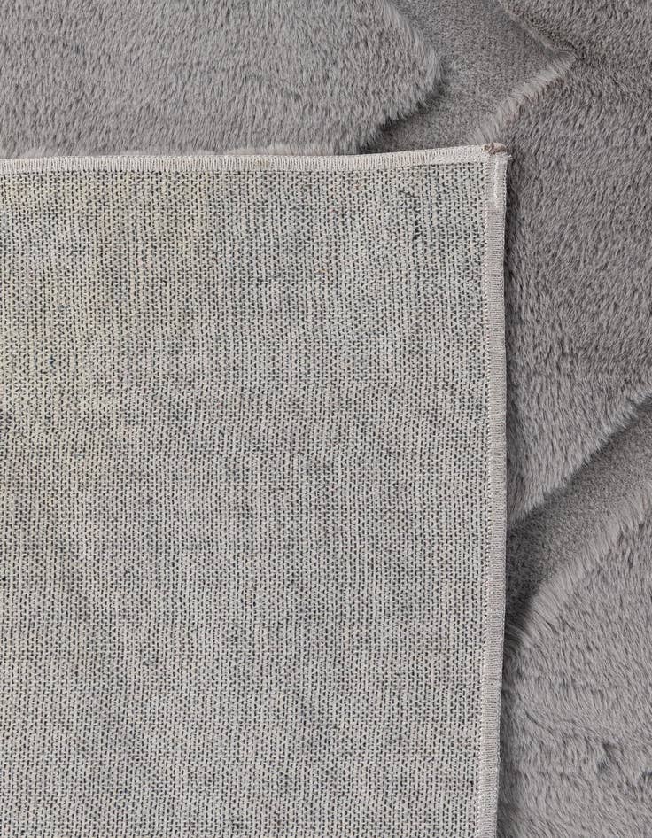 Detail image of 5' 1 x 7' Carved Solid Rabbit Rug