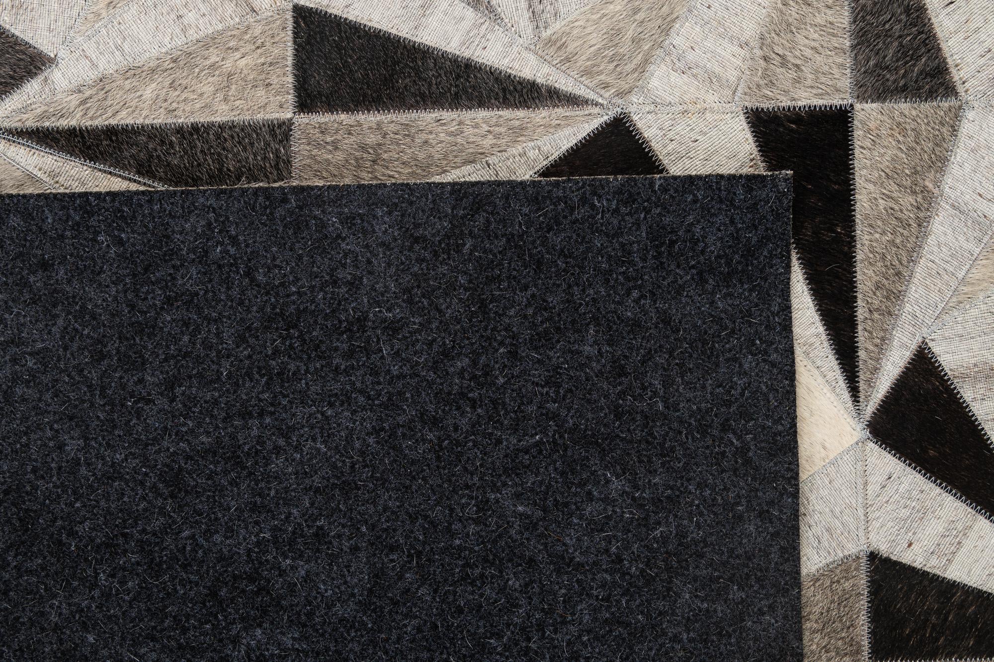 4' 11 x 7' 10 Cowhide - Patchwork Rug