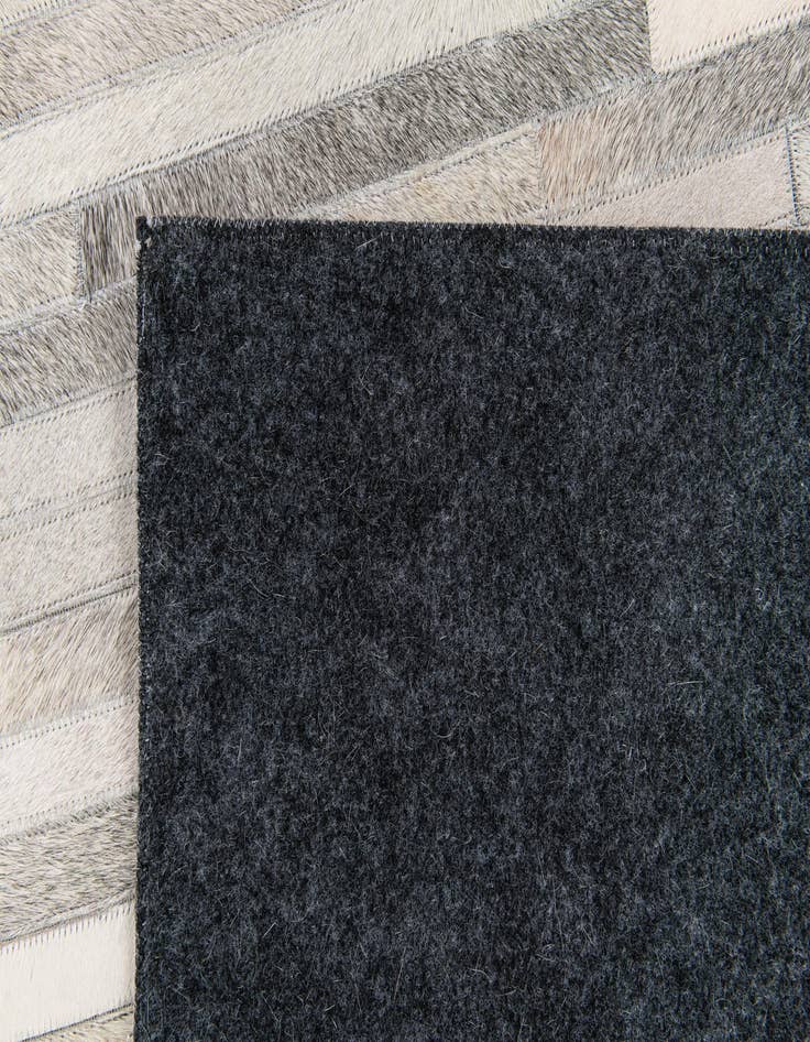 Detail image of 5' 1 x 8' Cowhide Stocks Rug