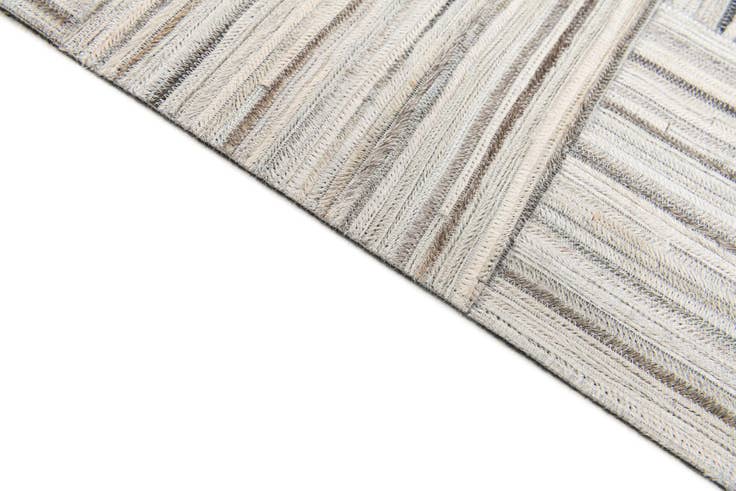 Detail image of 4' 11 x 8' 2 Cowhide Stocks Rug