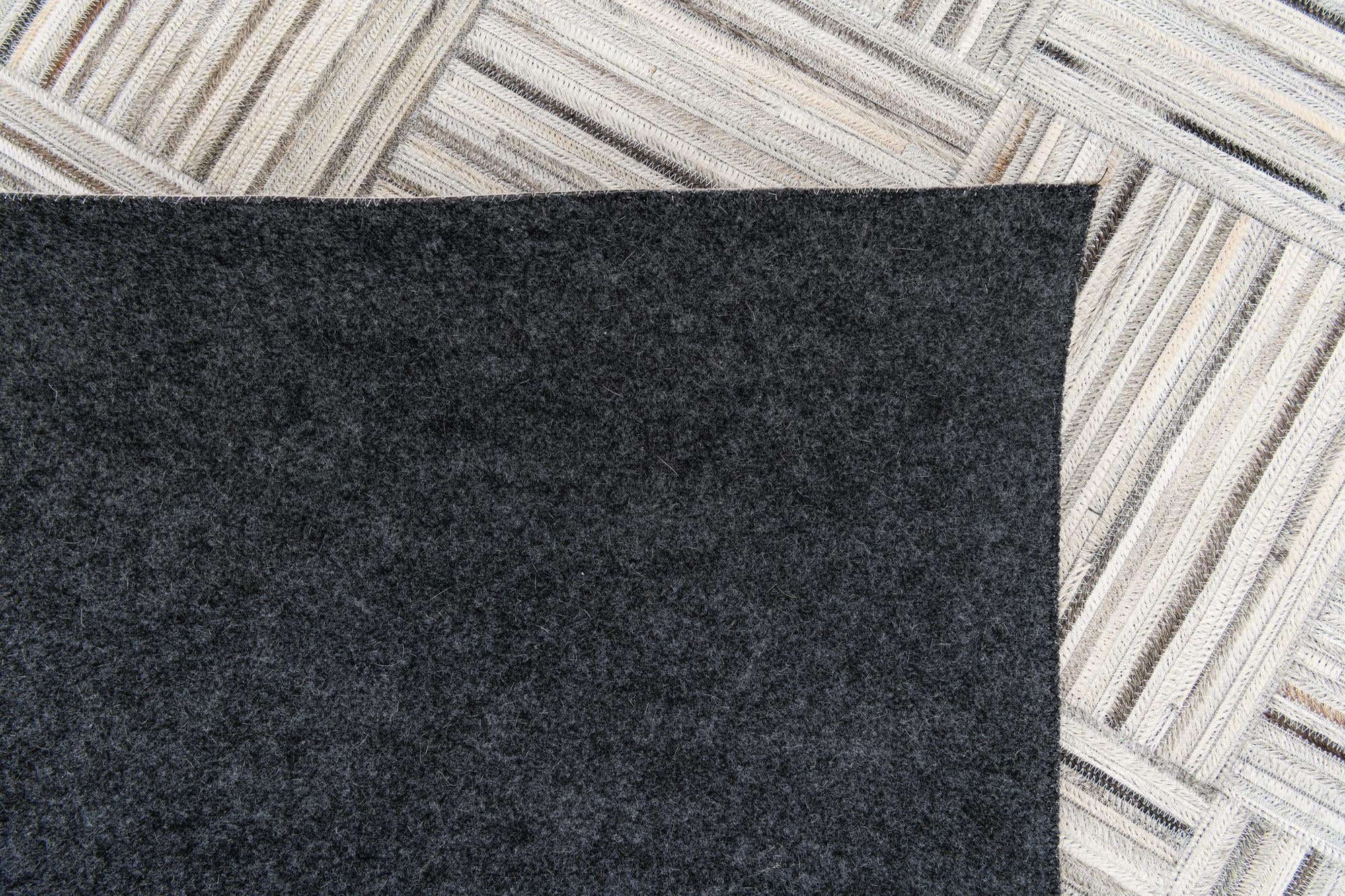 4' 11 x 8' 2 Cowhide Stocks Rug