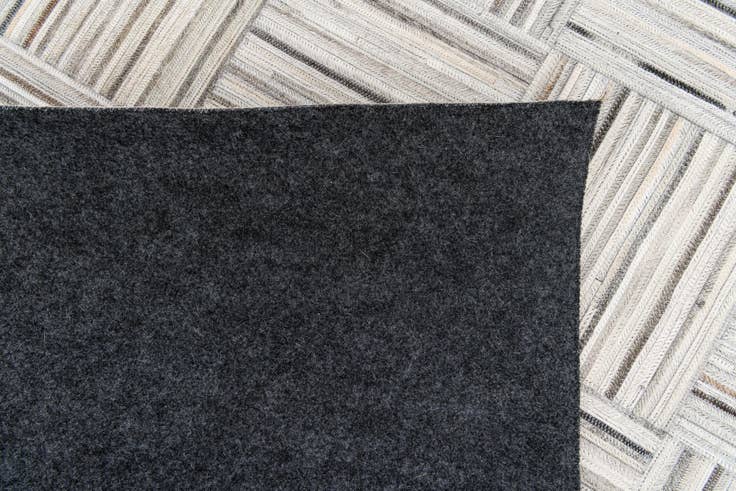 Detail image of 4' 11 x 8' 2 Cowhide Stocks Rug