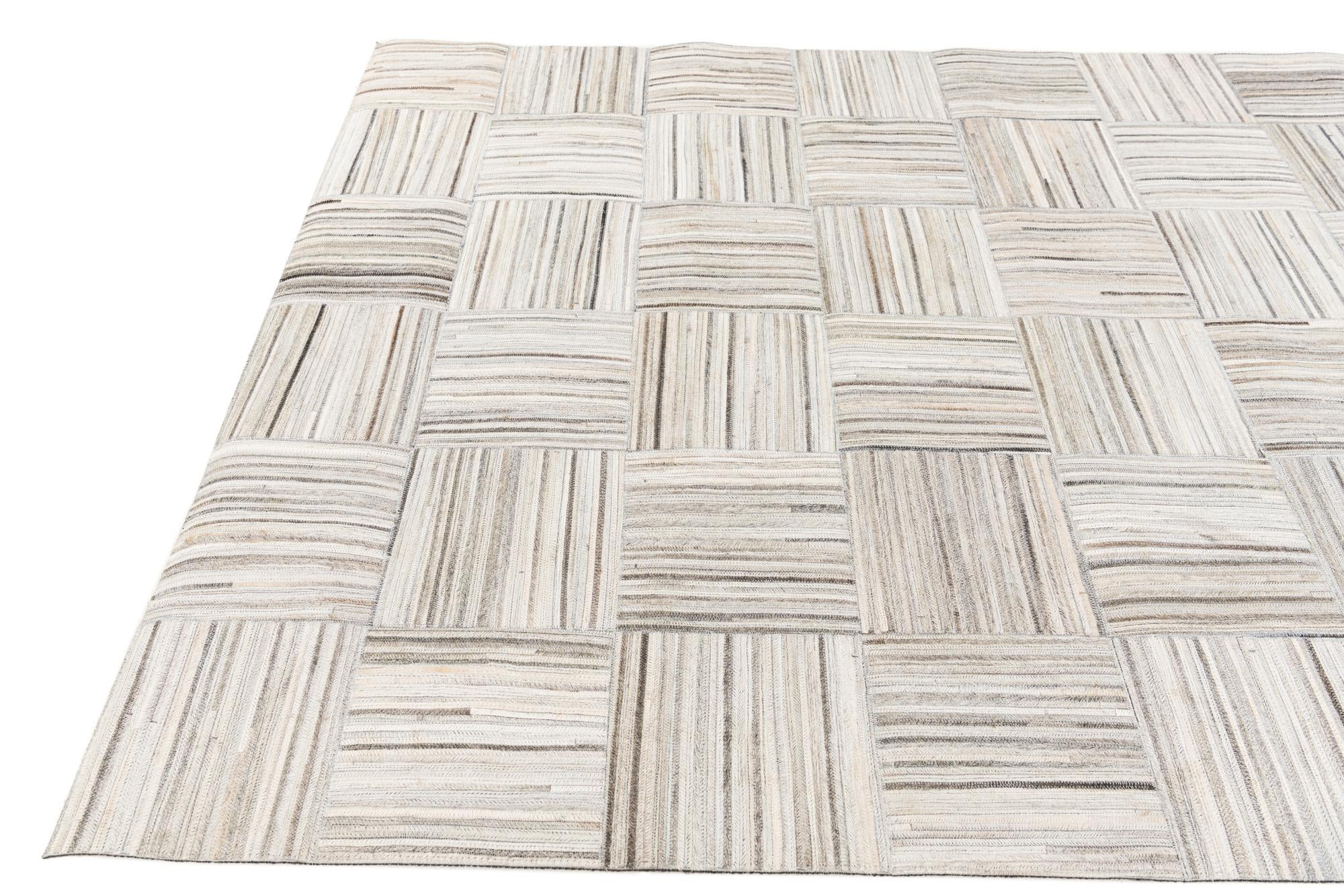 4' 11 x 8' 2 Cowhide Stocks Rug