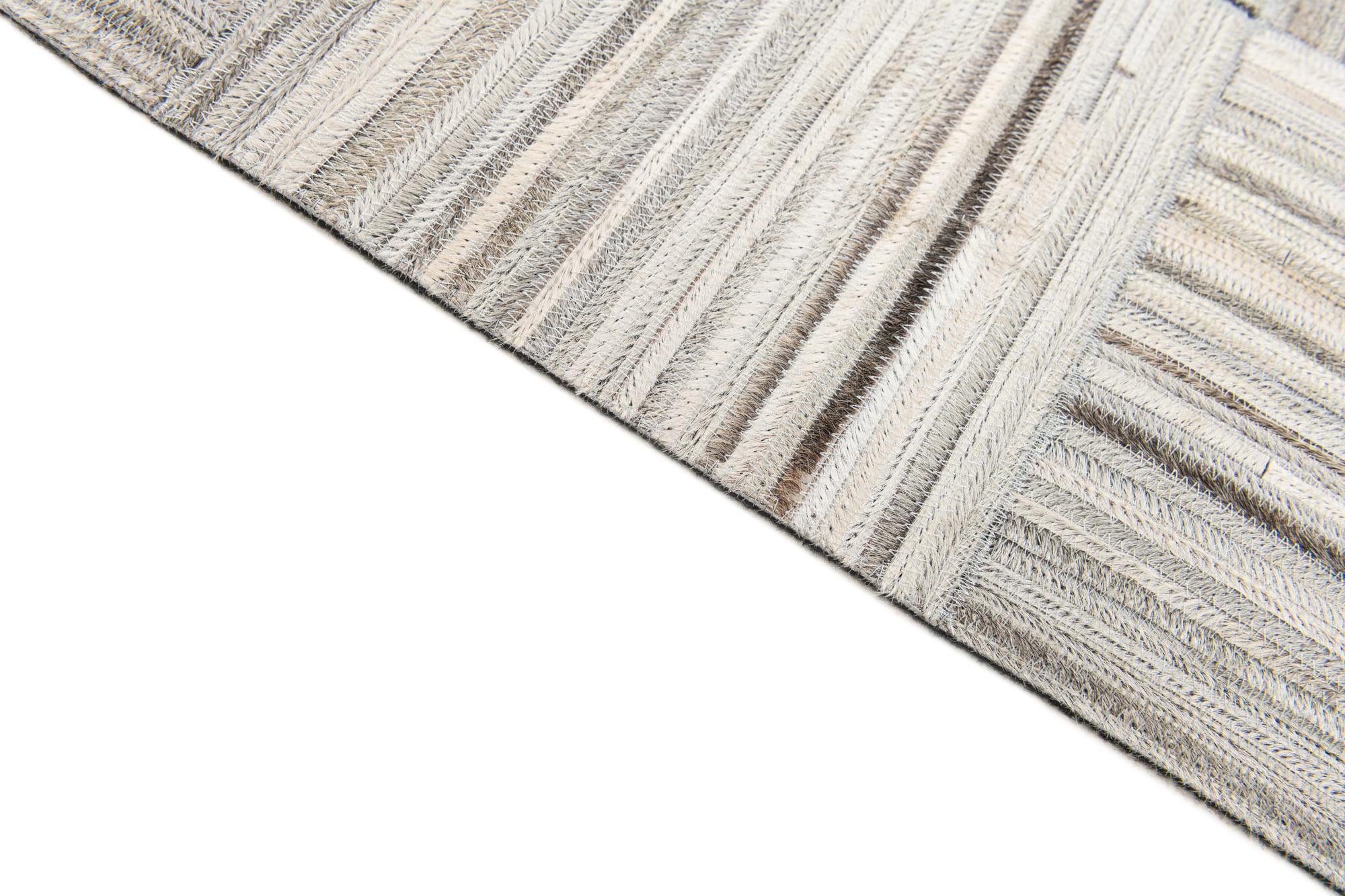 4' 11 x 8' 2 Cowhide Stocks Rug