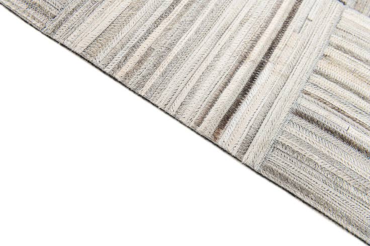 Detail image of 4' 11 x 8' 2 Cowhide Stocks Rug