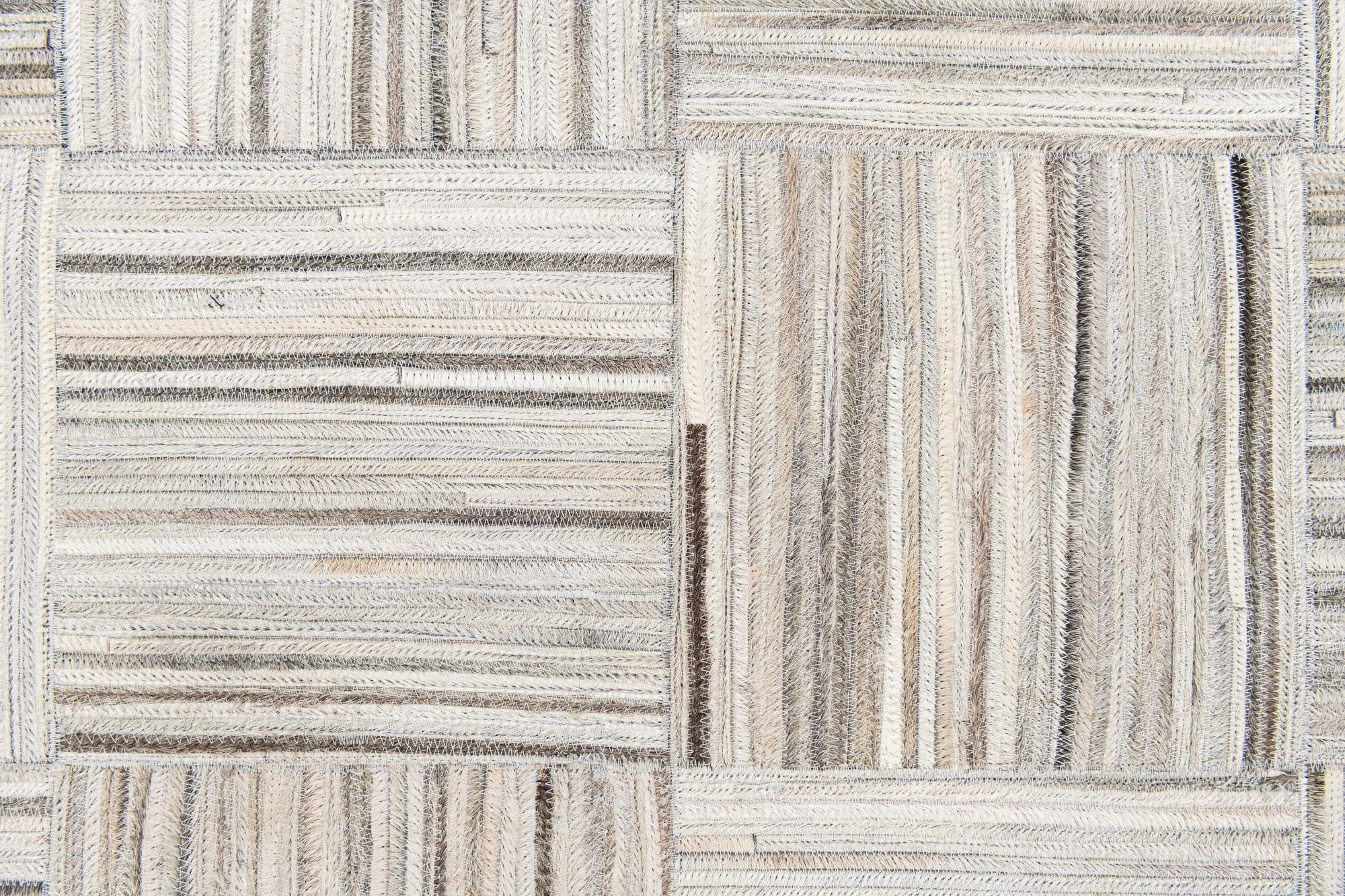 4' 11 x 8' 2 Cowhide Stocks Rug