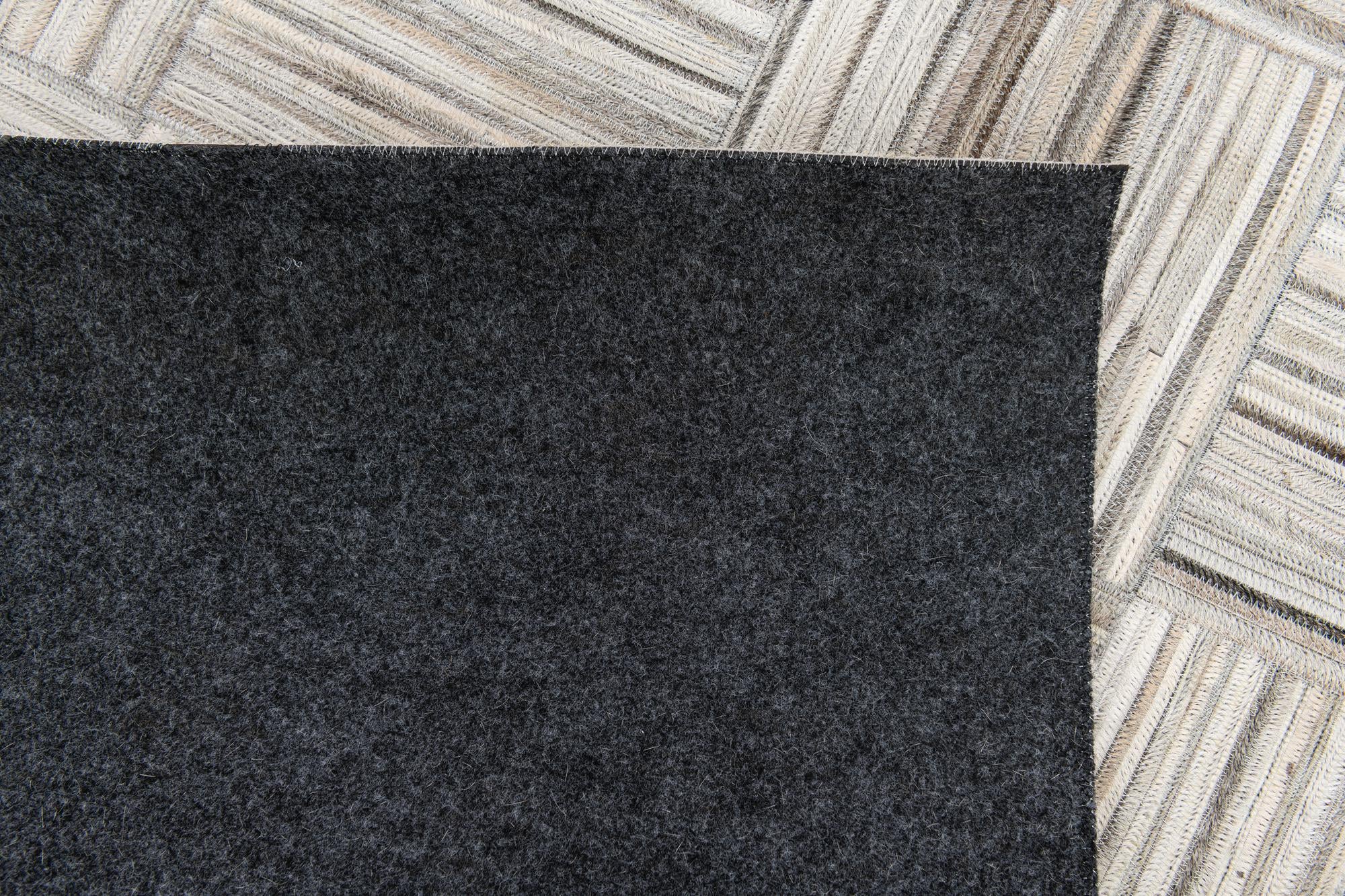4' 11 x 8' 2 Cowhide Stocks Rug