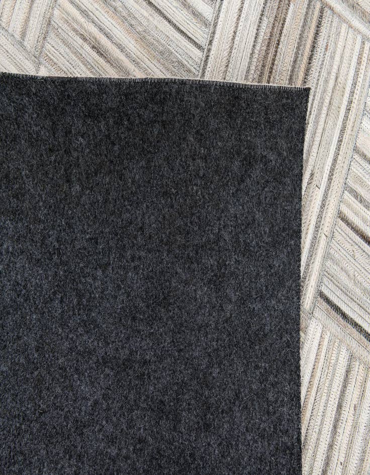 Detail image of 4' 11 x 8' 2 Cowhide Stocks Rug