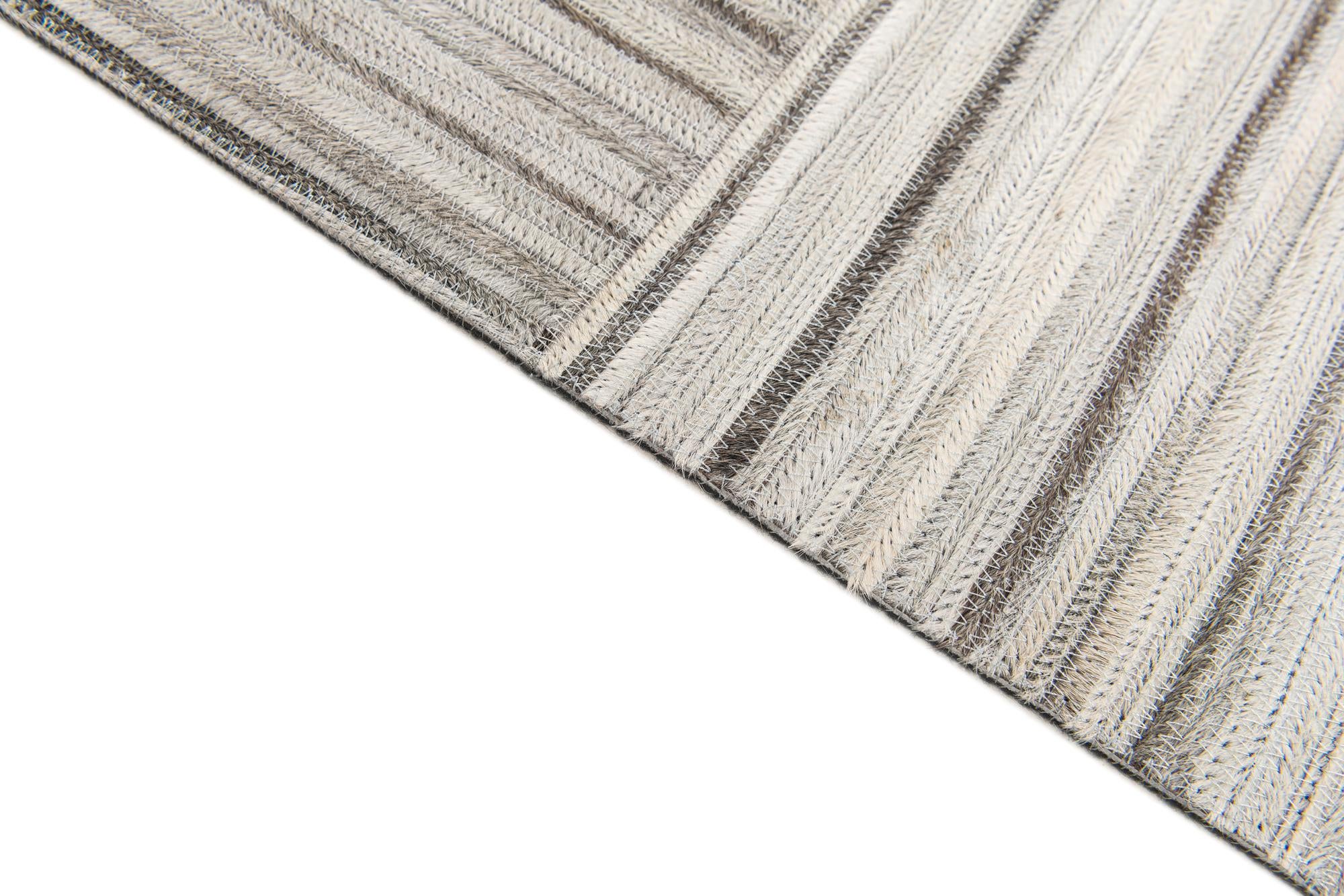 4' 11 x 8' 2 Cowhide Stocks Rug