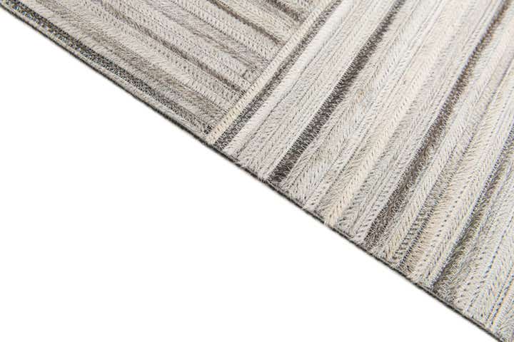 4' 11 x 8' 2 Cowhide Stocks Rug